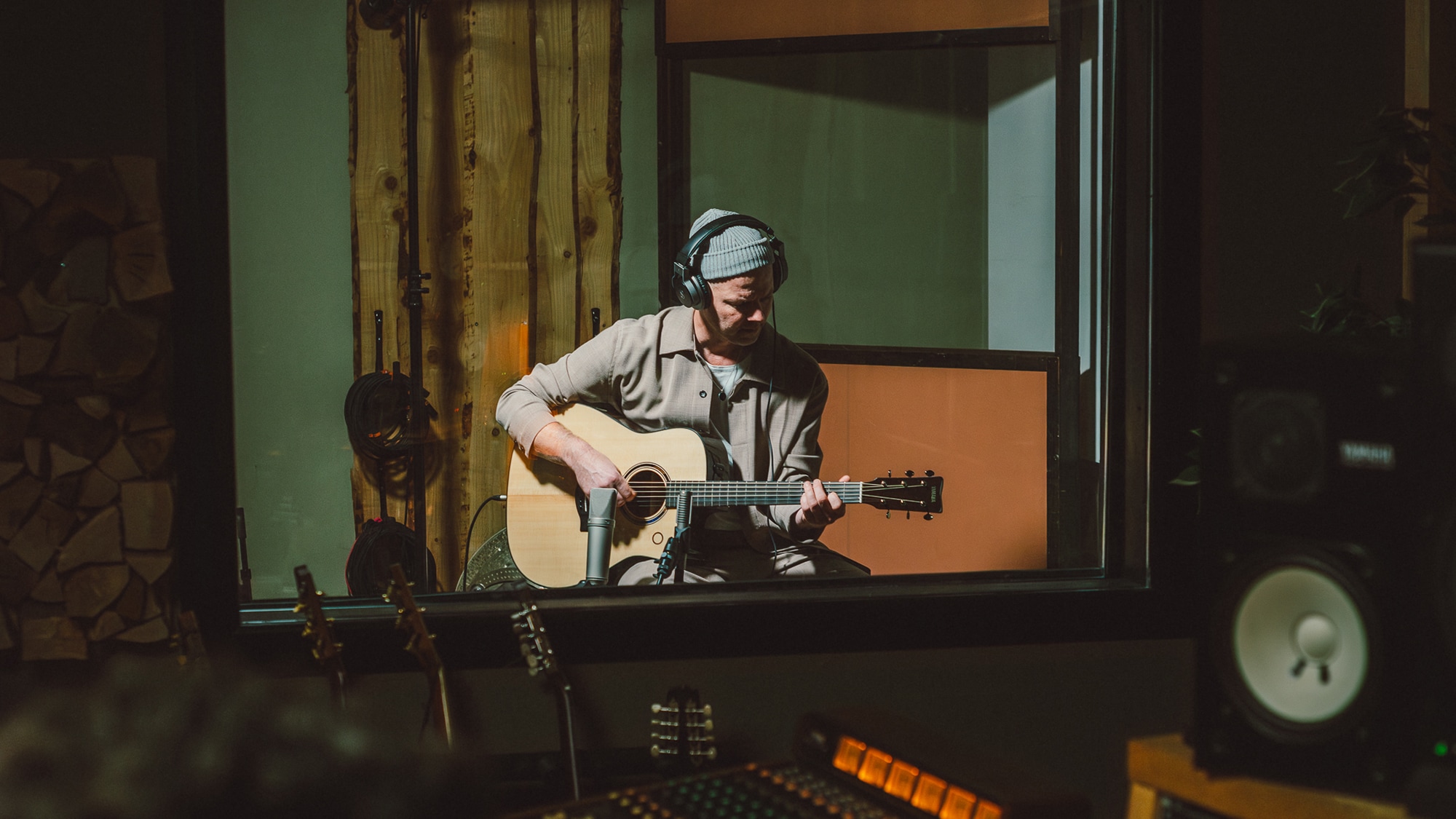Artist recording in a studio with the TAG3 C acoustic guitar.