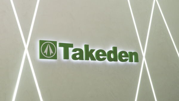TAKEDEN logo signage mounted on an interior wall